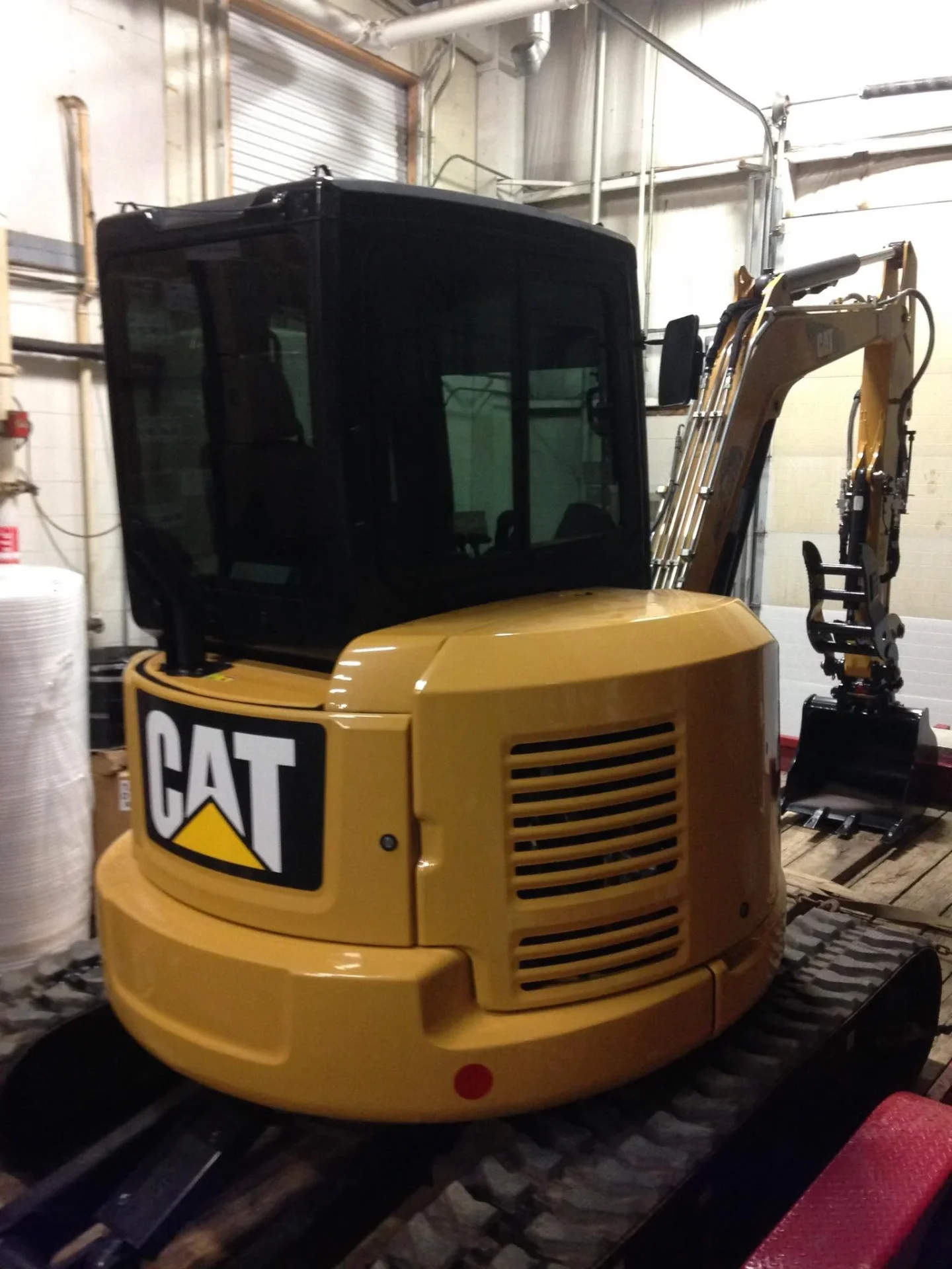 CAT mini excavator with heavy equipment tint