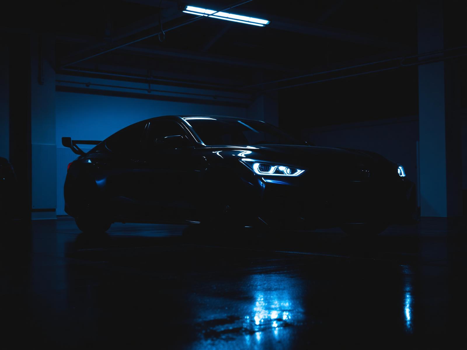 Tinted luxury car in dark garage